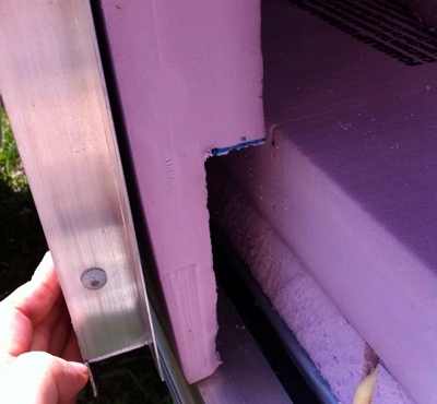 First layer on the door is cut so that it squeezes up against the floor insulation.